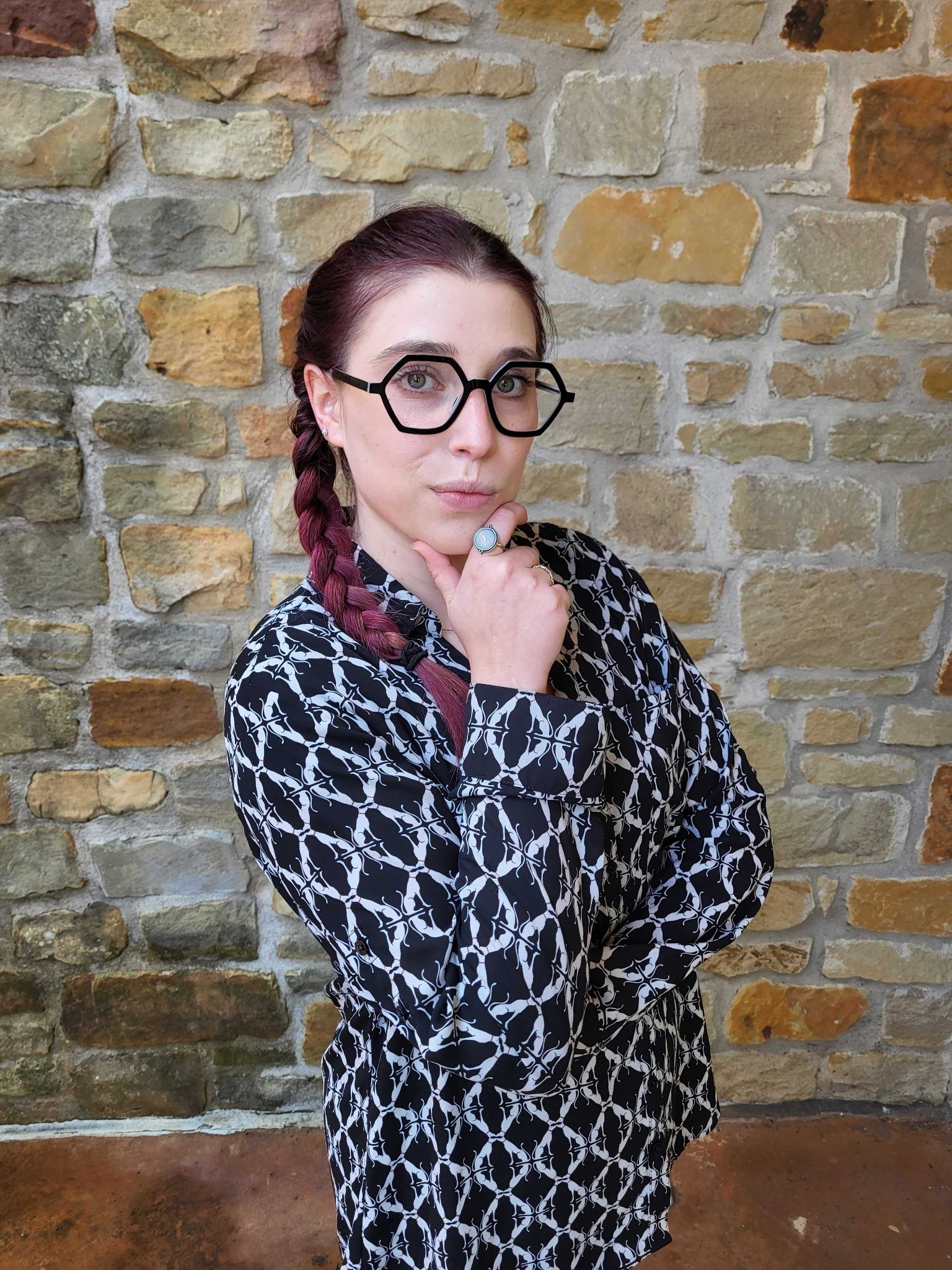 Bright Side Optical client wearing bold black geometric glasses